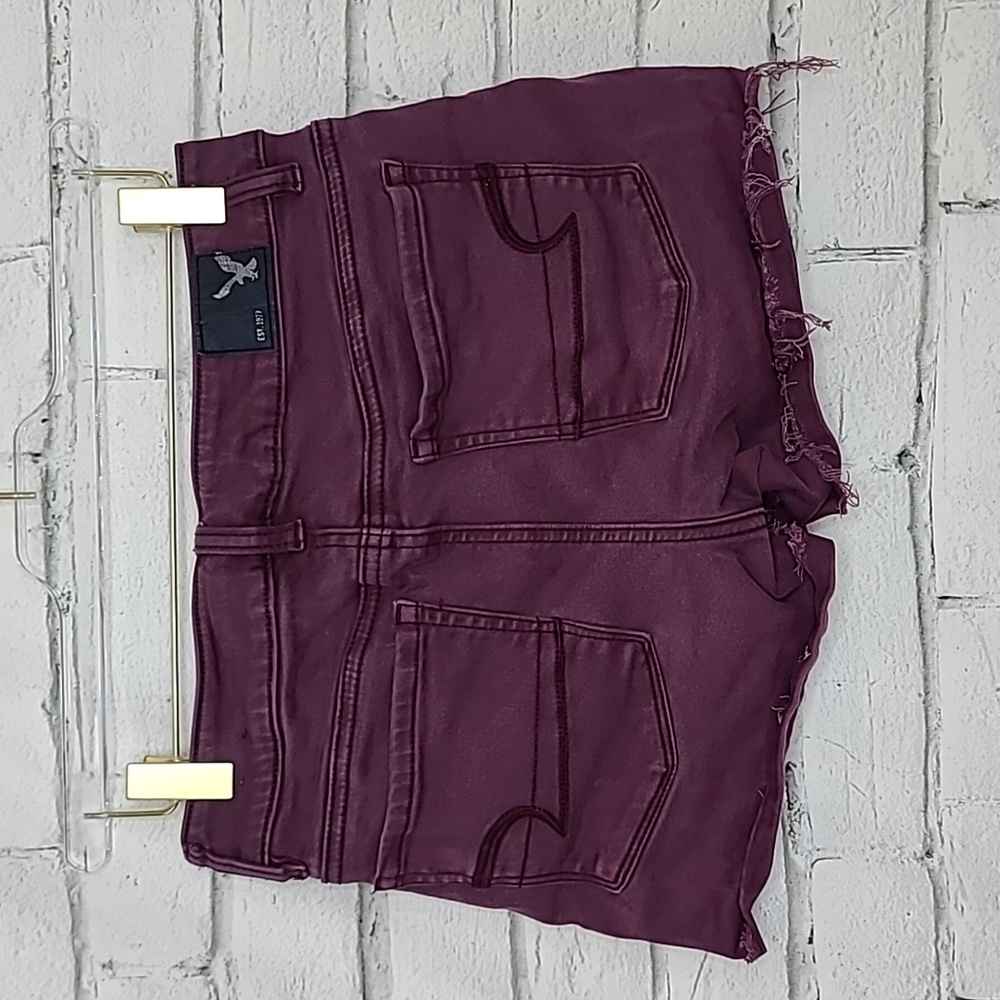 AE Next Level Low Rise Cuffed Raw Hem Cotton Denim Shortie Shorts in Burgundy - Picture 7 of 17